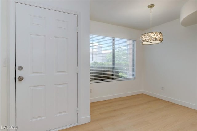 8450 Alta Dr Unit 136, Las Vegas, NV 89145 - empty room with baseboards and light wood-style floors