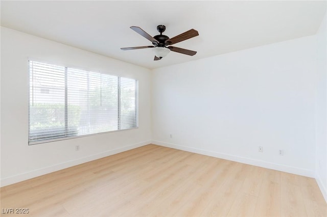 8450 Alta Dr Unit 136, Las Vegas, NV 89145 - unfurnished room with baseboards, a ceiling fan, light wood-style floors, and plenty of natural light