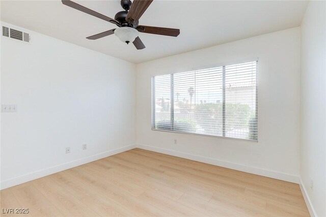 8450 Alta Dr Unit 136, Las Vegas, NV 89145 - unfurnished room featuring a ceiling fan, baseboards, and light wood-type flooring