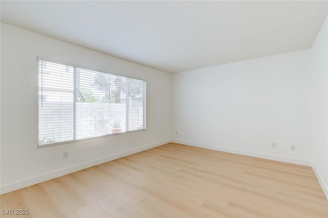 8450 Alta Dr Unit 136, Las Vegas, NV 89145 - spare room featuring light wood-style floors and baseboards