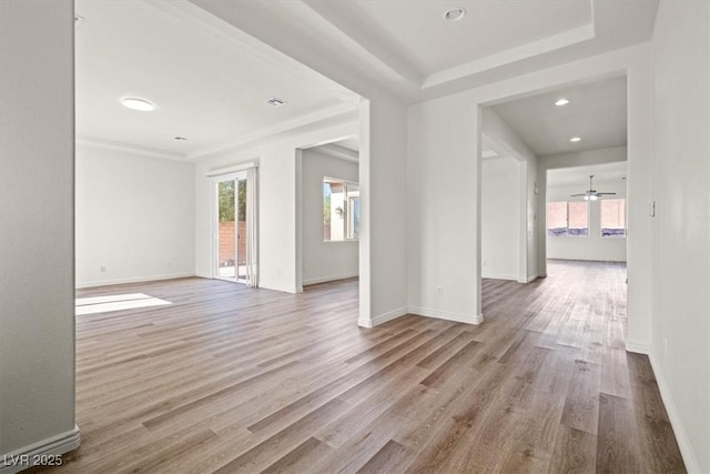 spare room with baseboards, recessed lighting, wood finished floors, and plenty of natural light