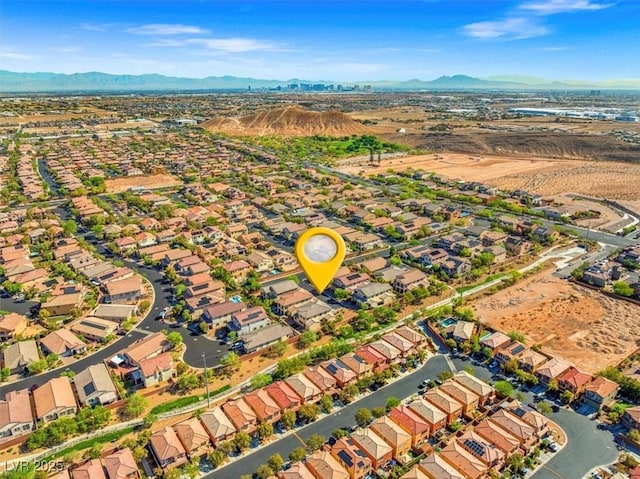 aerial view featuring a mountain view and a residential view