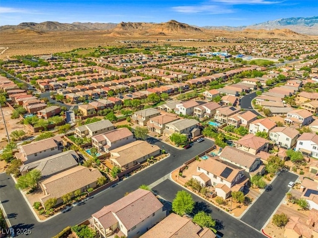 drone / aerial view featuring a mountain view and a residential view