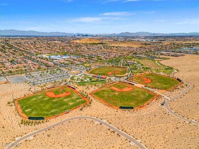 birds eye view of property featuring a mountain view and a desert view