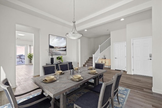 dining room with recessed lighting, stairs, wood finished floors, and baseboards