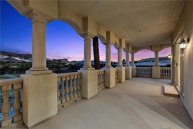 view of patio featuring a balcony