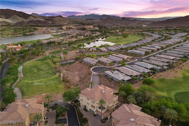 birds eye view of property featuring a residential view, golf course view, and a water and mountain view