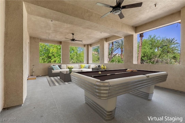 game room with billiards and a ceiling fan