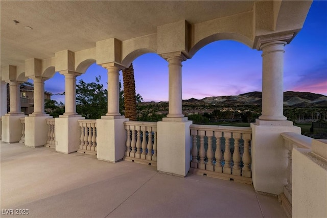 view of patio terrace at dusk