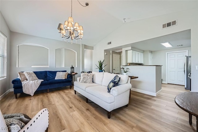 10550 W Alexander Rd Unit 2179, Las Vegas, NV 89129 - living area with vaulted ceiling, light wood-style flooring, a chandelier, and baseboards