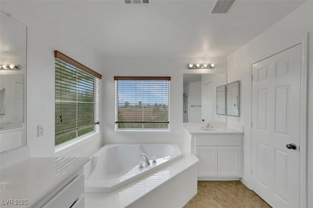 3217 Palladio Ave, North Las Vegas, NV 89031 - bathroom featuring a garden tub and two vanities