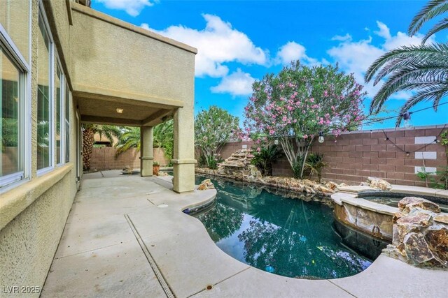 3217 Palladio Ave, North Las Vegas, NV 89031 - view of swimming pool with a fenced backyard, a patio, and a pool with connected hot tub