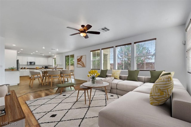 3217 Palladio Ave, North Las Vegas, NV 89031 - living area with light wood finished floors, a ceiling fan, and recessed lighting
