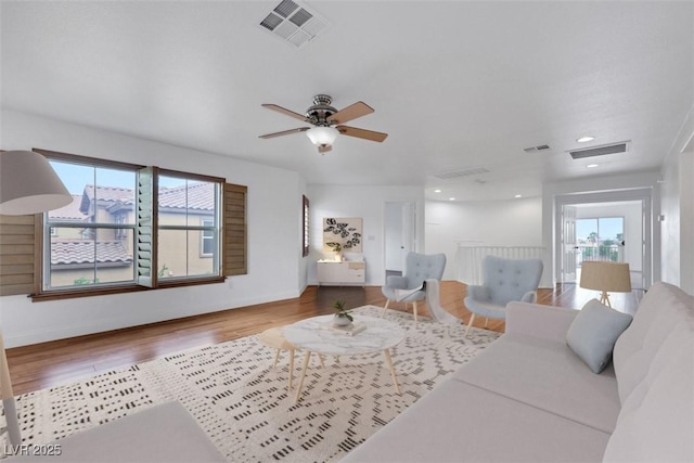 3217 Palladio Ave, North Las Vegas, NV 89031 - living room featuring healthy amount of natural light, wood finished floors, and ceiling fan