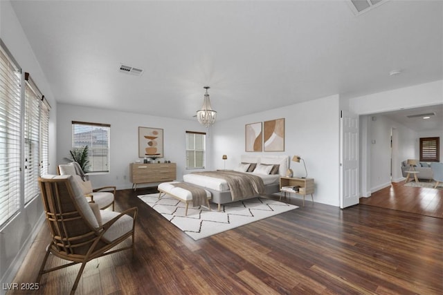 3217 Palladio Ave, North Las Vegas, NV 89031 - bedroom with wood finished floors and a chandelier