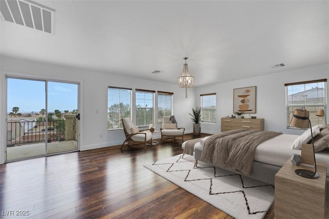 3217 Palladio Ave, North Las Vegas, NV 89031 - bedroom featuring access to exterior, wood finished floors, and a chandelier