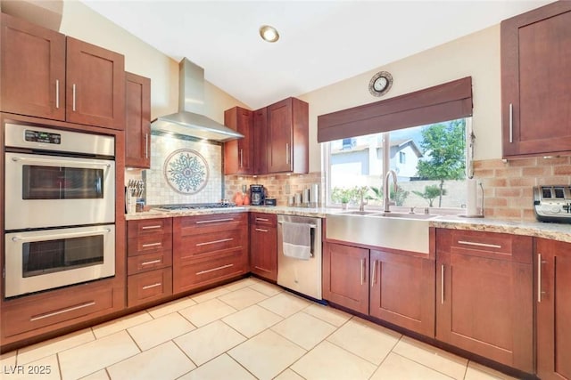 3920 Autumn St, Las Vegas, NV 89120 - kitchen featuring appliances with stainless steel finishes, wall chimney range hood, decorative backsplash, a sink, and recessed lighting