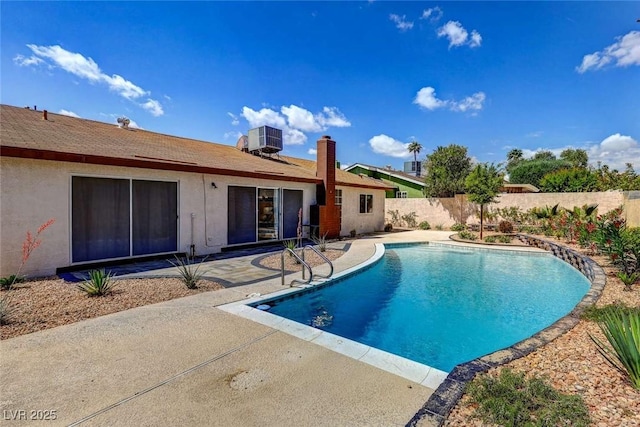 3920 Autumn St, Las Vegas, NV 89120 - view of swimming pool featuring central air condition unit, a patio area, and a fenced backyard
