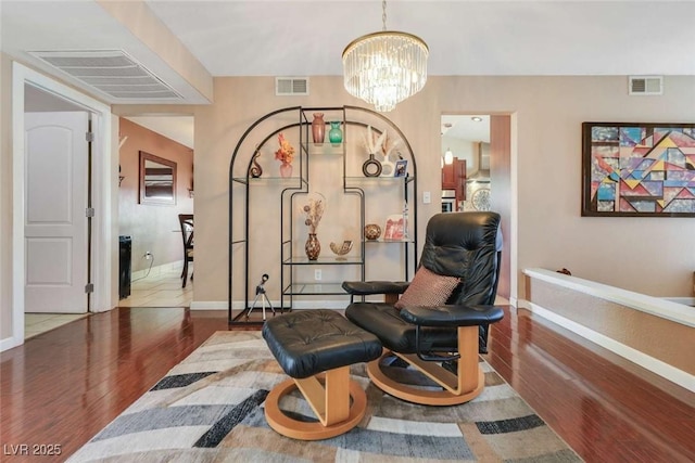 3920 Autumn St, Las Vegas, NV 89120 - sitting room with wood finished floors, baseboards, and a chandelier