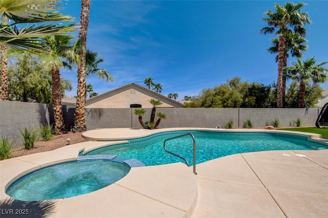 view of pool featuring a pool with connected hot tub, a patio, and a fenced backyard