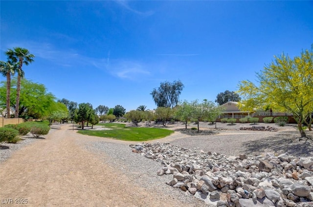 view of community featuring fence