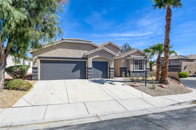 ranch-style house featuring a tiled roof, stucco siding, concrete driveway, and an attached garage