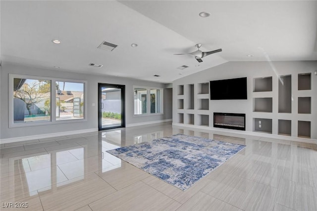 7575 Coley Ave, Las Vegas, NV 89117 - living room with built in features, plenty of natural light, a ceiling fan, vaulted ceiling, and a glass covered fireplace