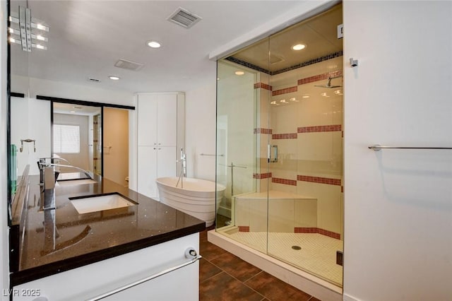 7575 Coley Ave, Las Vegas, NV 89117 - full bathroom featuring vanity, a shower stall, tile patterned floors, and recessed lighting