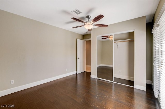 7575 Coley Ave, Las Vegas, NV 89117 - unfurnished bedroom with a closet, wood finished floors, and a ceiling fan