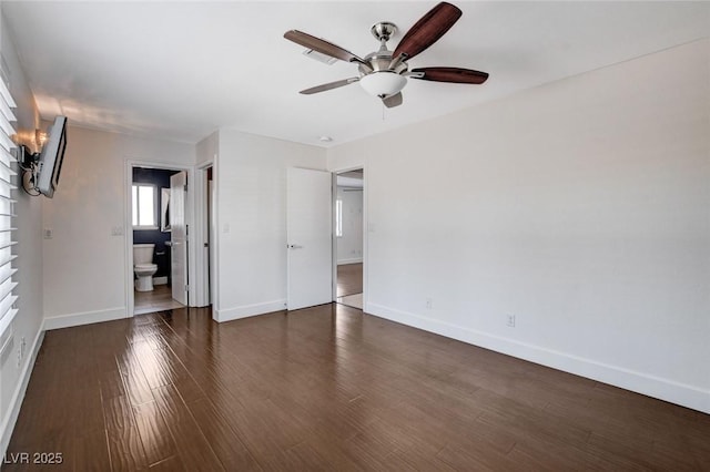 7575 Coley Ave, Las Vegas, NV 89117 - unfurnished bedroom with connected bathroom, dark wood finished floors, and ceiling fan