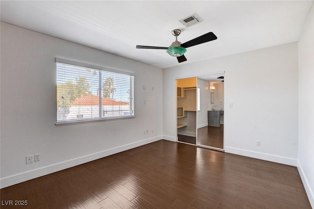 7575 Coley Ave, Las Vegas, NV 89117 - unfurnished bedroom with dark wood-type flooring, ceiling fan, a walk in closet, and a closet