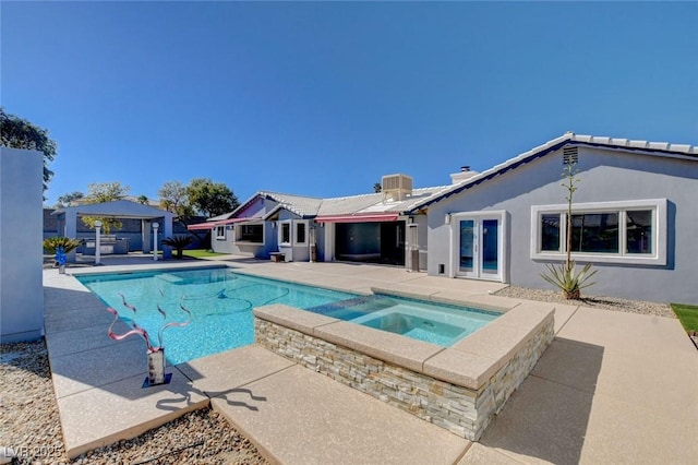 7575 Coley Ave, Las Vegas, NV 89117 - view of pool with a gazebo, a patio, a pool with connected hot tub, and french doors