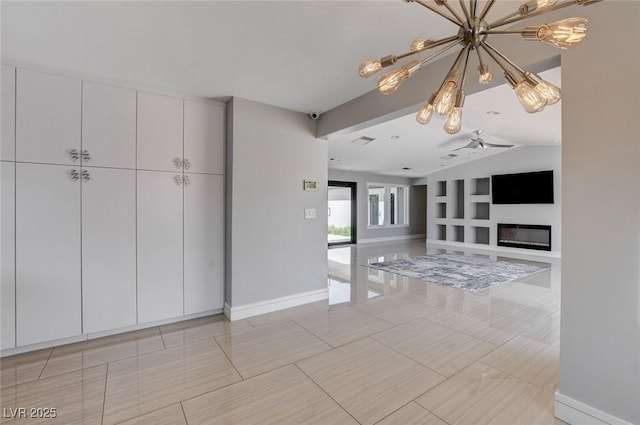 7575 Coley Ave, Las Vegas, NV 89117 - unfurnished living room with a chandelier, built in features, lofted ceiling, light tile patterned floors, and a glass covered fireplace