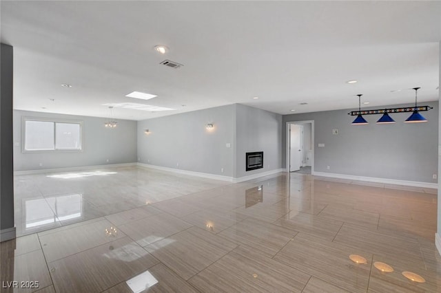 7575 Coley Ave, Las Vegas, NV 89117 - unfurnished room with a glass covered fireplace and recessed lighting