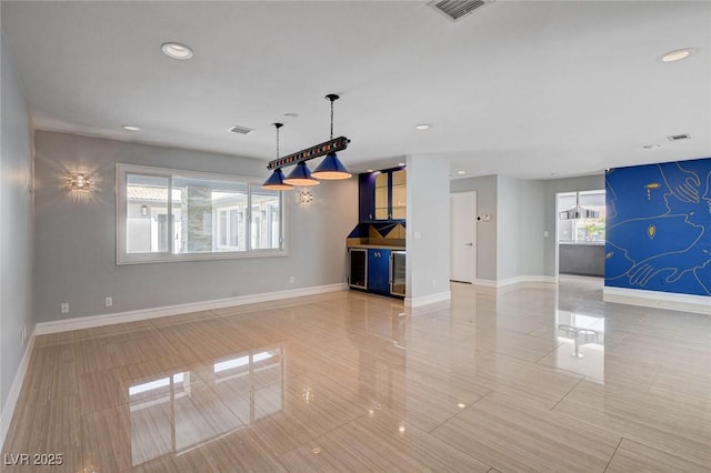 7575 Coley Ave, Las Vegas, NV 89117 - unfurnished living room featuring recessed lighting, a bar, tile patterned flooring, and beverage cooler