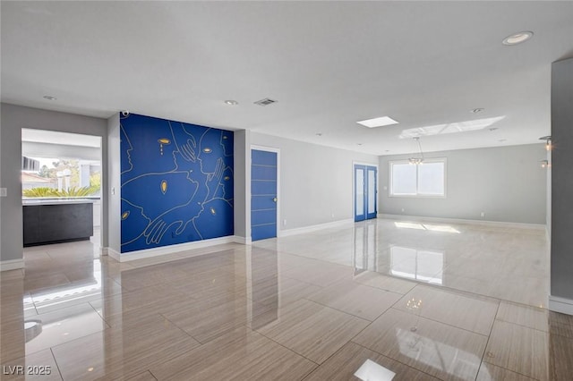 7575 Coley Ave, Las Vegas, NV 89117 - empty room with recessed lighting and a skylight