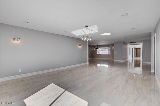 7575 Coley Ave, Las Vegas, NV 89117 - unfurnished living room with baseboards and a chandelier