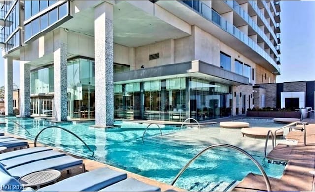 4381 W Flamingo Rd Unit 1212, Las Vegas, NV 89103 - pool with a patio
