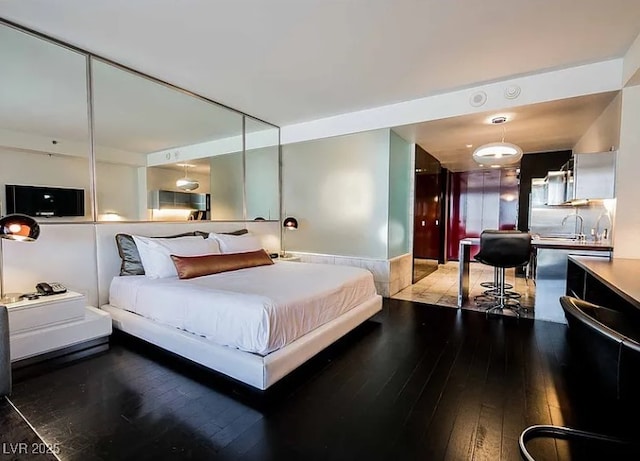 4381 W Flamingo Rd Unit 1212, Las Vegas, NV 89103 - bedroom with hardwood / wood-style flooring and a sink