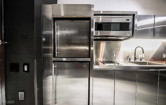4381 W Flamingo Rd Unit 1212, Las Vegas, NV 89103 - kitchen with stainless steel microwave, a sink, and stainless steel countertops