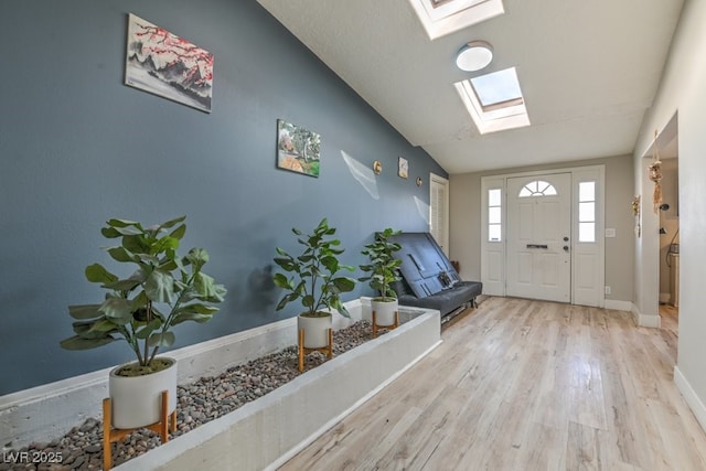 2129 N Michael Way, Las Vegas, NV 89108 - entryway featuring a skylight, wood finished floors, and vaulted ceiling