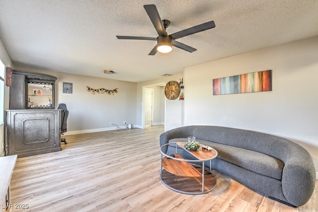 2129 N Michael Way, Las Vegas, NV 89108 - living area with a textured ceiling, a ceiling fan, and wood finished floors