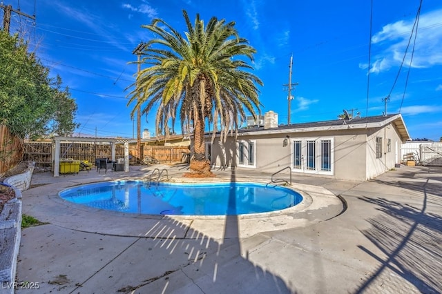 2129 N Michael Way, Las Vegas, NV 89108 - view of swimming pool featuring french doors, a patio area, and a fenced backyard