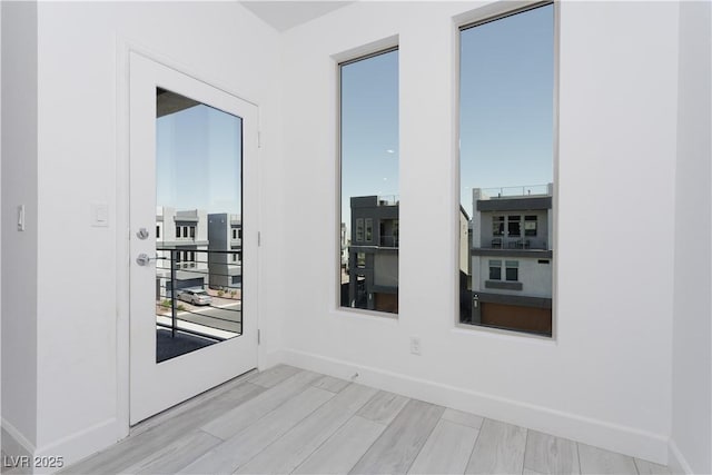 8125 Monsoon Bay St, Las Vegas, NV 89113 - unfurnished room featuring baseboards and light wood finished floors