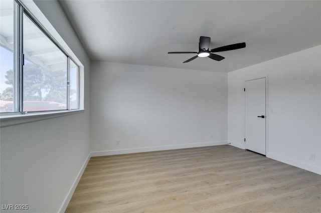 2671 Diamante Cir, Las Vegas, NV 89121 - empty room with light wood-type flooring, baseboards, and a ceiling fan