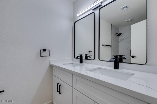 2671 Diamante Cir, Las Vegas, NV 89121 - bathroom featuring a sink, double vanity, and visible vents