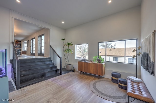 interior space featuring recessed lighting, stairway, wood finished floors, and baseboards