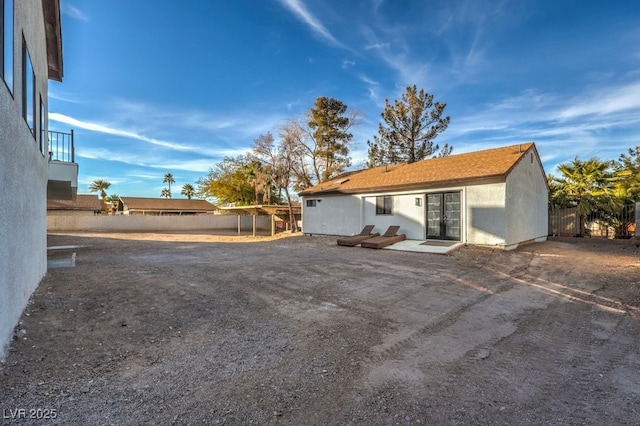 exterior space featuring french doors and fence