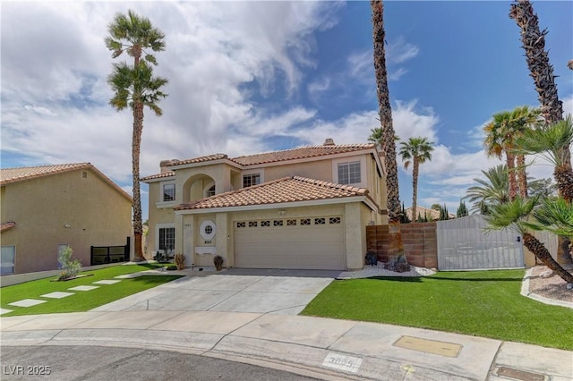 mediterranean / spanish home with a tile roof, a garage, concrete driveway, stucco siding, and fence