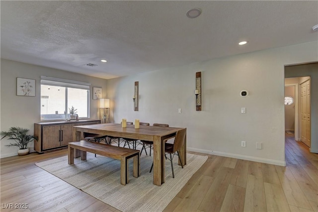 dining space featuring recessed lighting, visible vents, baseboards, and light wood-type flooring
